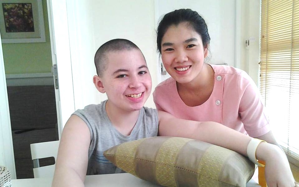 CP patient Renzo with nurse during stem cell treatment